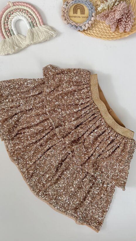 Mirdzoši fliteru svārki bronzīgā tonī